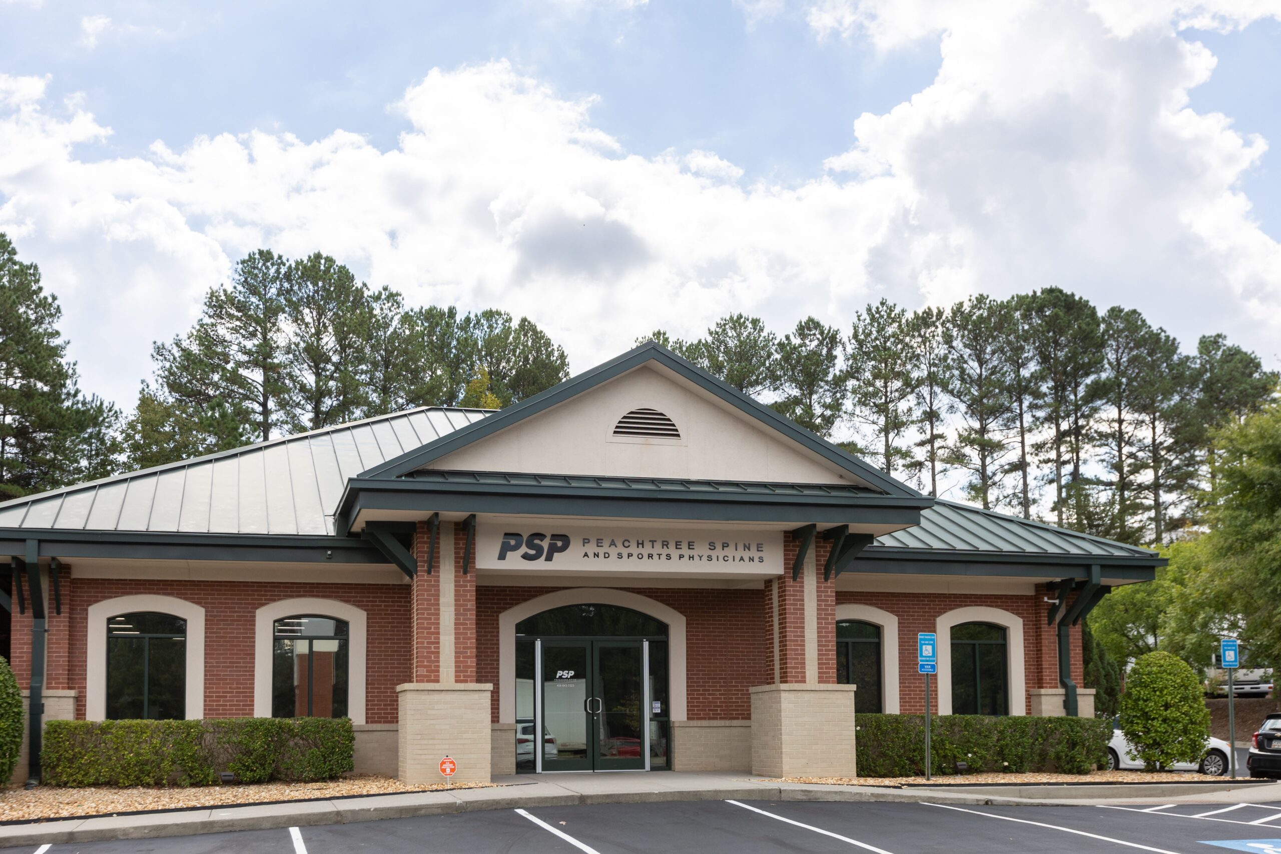 Peachtree Spine & Sports Physicians Norcross office exterior at 4830 Peachtree Industrial Blvd